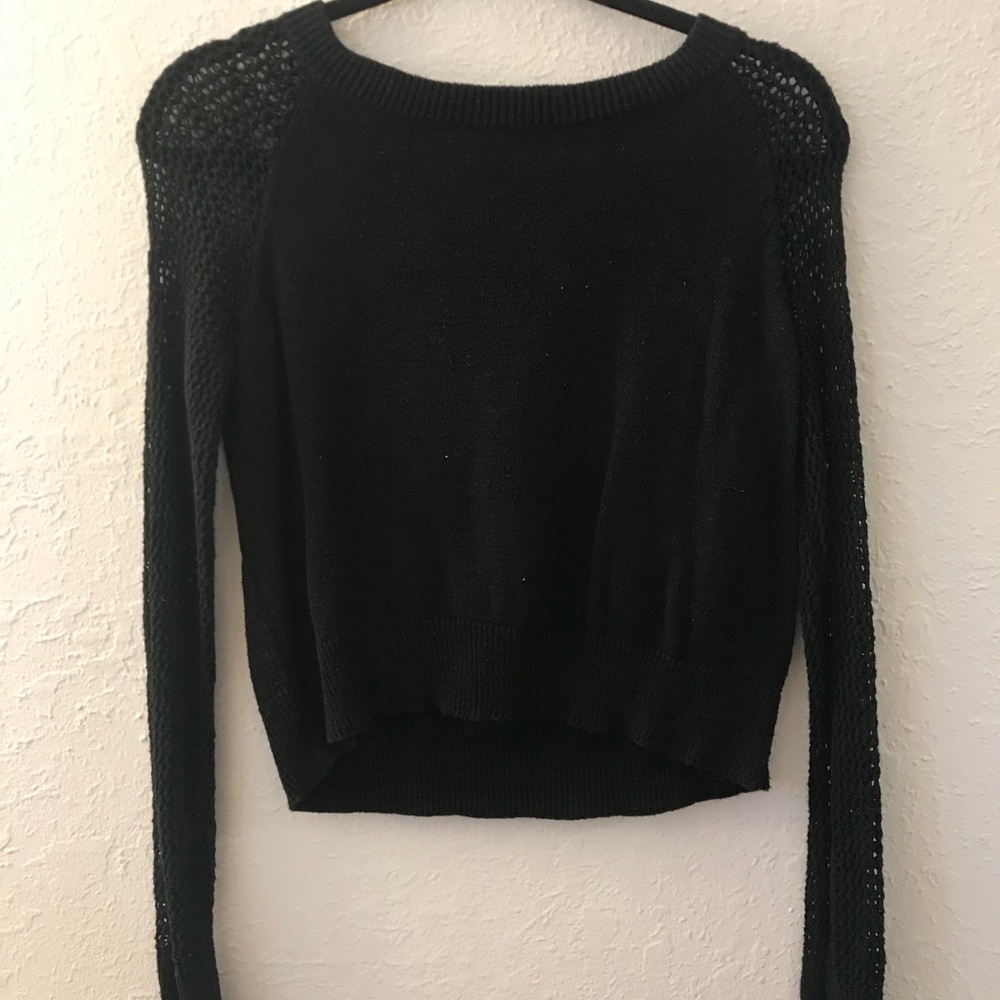 Black crop sweater with loose weave arms